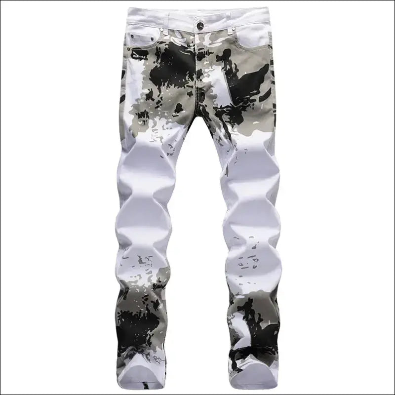 Pair of white jeans with black paint-like splatters and distressed details.