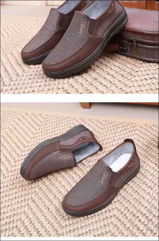 Pair of brown leather slip-on loafers with textured uppers and thick soles.