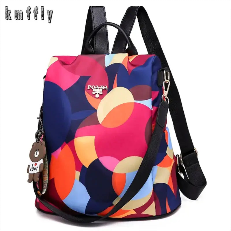 Colorful patterned backpack with black straps and a zipper closure.