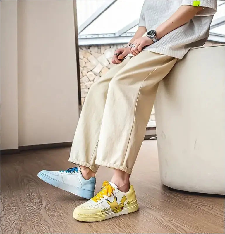 Pair of mismatched sneakers, one light blue and one yellow with white details.