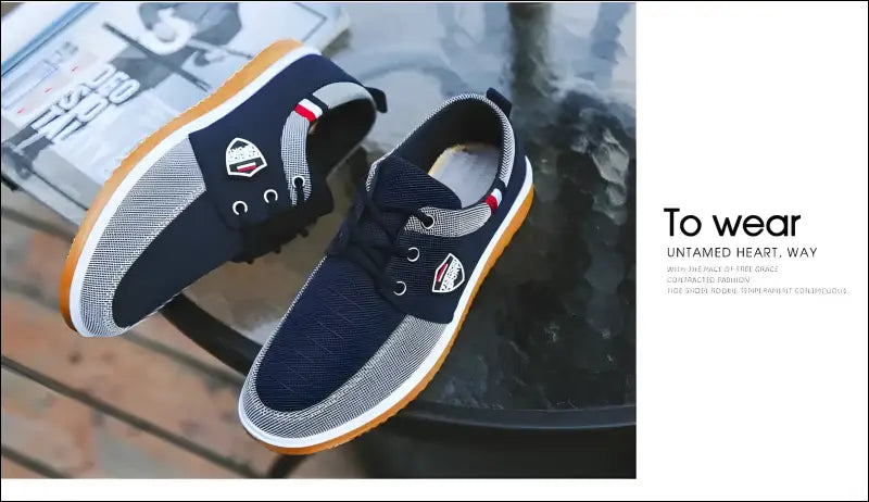 Pair of navy blue casual sneakers with white soles and colorful accents.