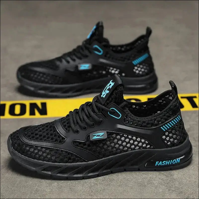 Black athletic sneakers with blue accents and mesh detailing.