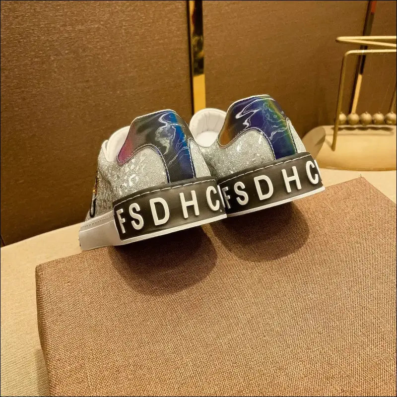 Pair of sunglasses with ’FSDHC’ printed on the frame.