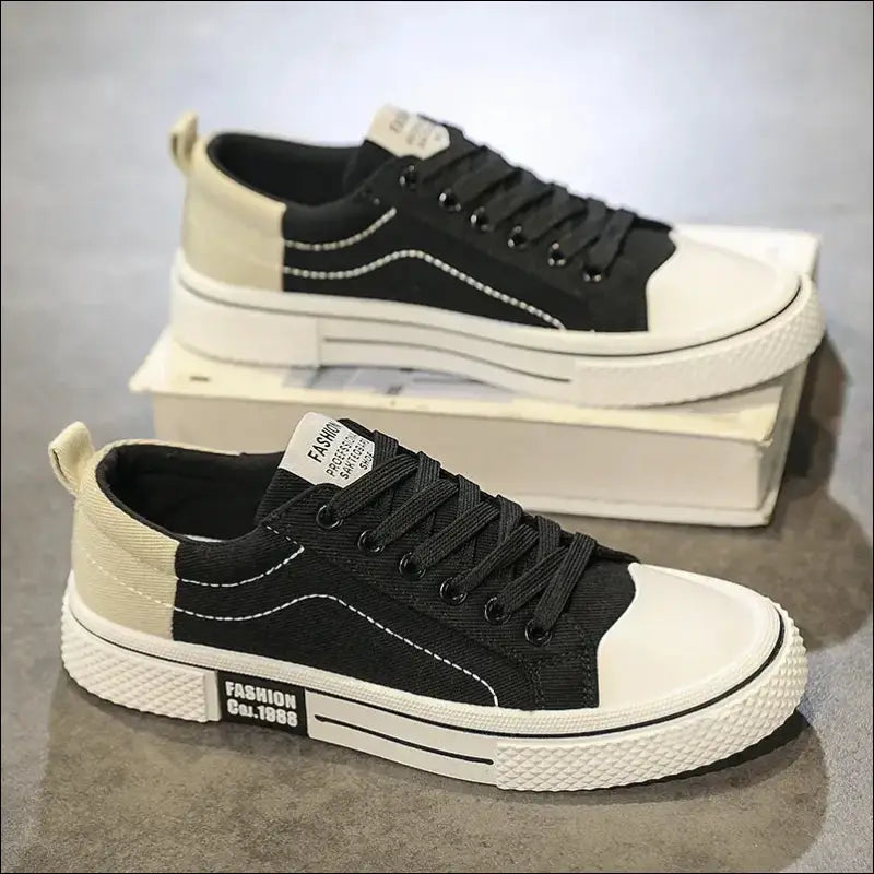 Black and white canvas sneaker with contrasting toe cap and sole.