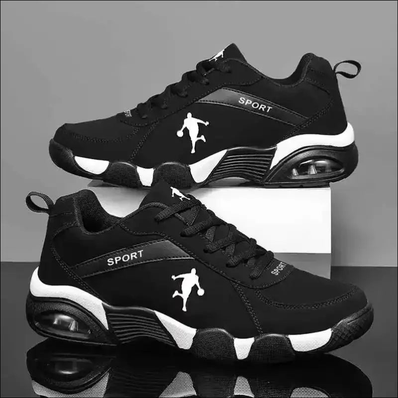 Black and white athletic sneakers with a basketball player silhouette logo.