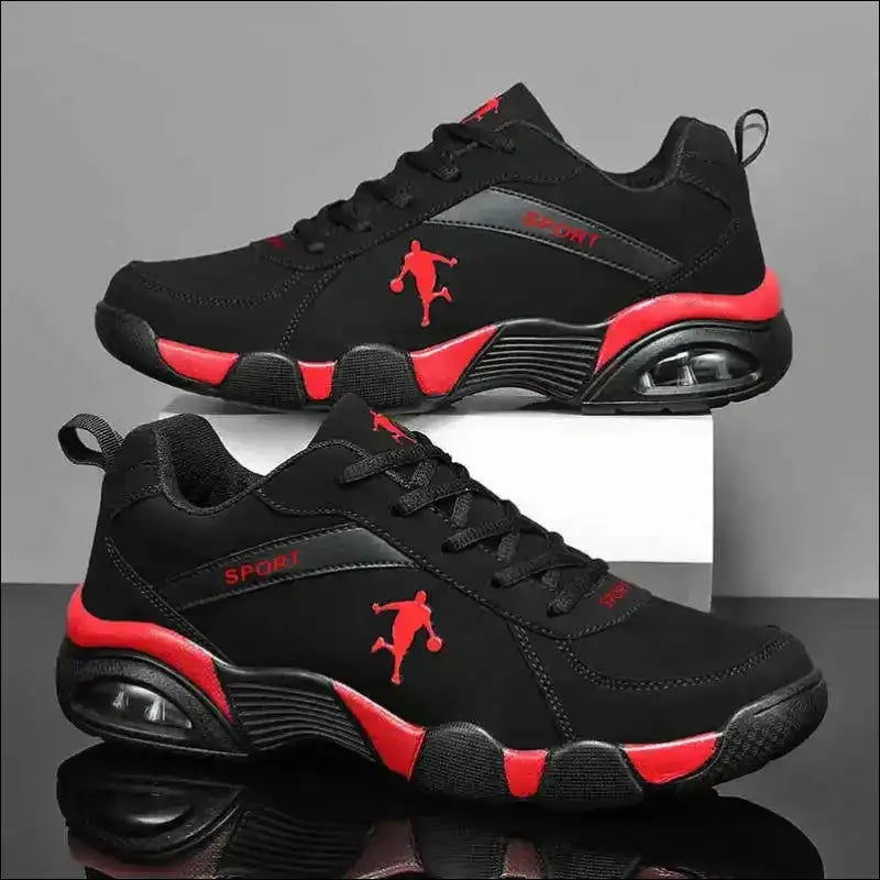 Black and red athletic sneakers with a basketball player silhouette logo.